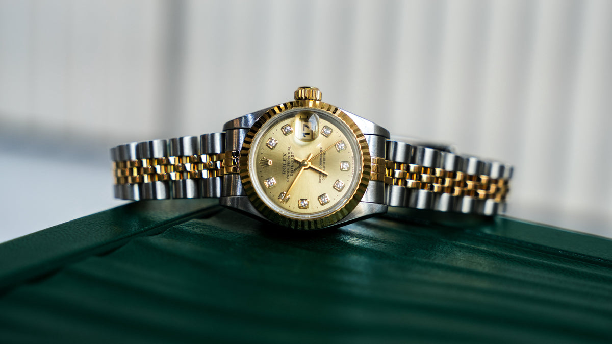 Pre-Owned Rolex Lady-Datejust 26mm â€“ 69173, Champagne Diamond Dial, 18k Yellow Gold & Stainless Steel Jubilee Bracelet