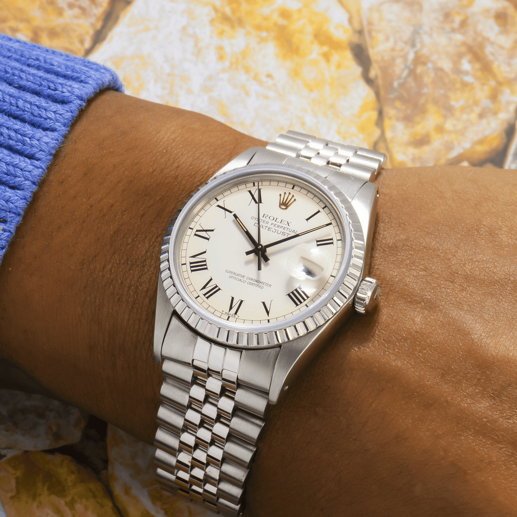 Pre-Owned Rolex Datejust 36MM 1603 White Roman Dial Engine Turned Bezel Stainless Steel Jubilee Bracelet