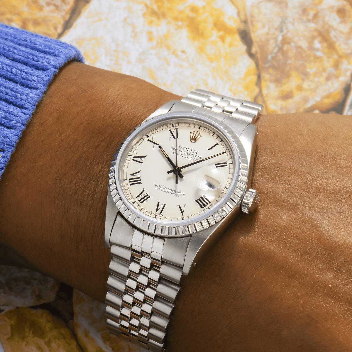 Pre-Owned Rolex Datejust 36MM 1603 White Roman Dial Engine Turned Bezel Stainless Steel Jubilee Bracelet