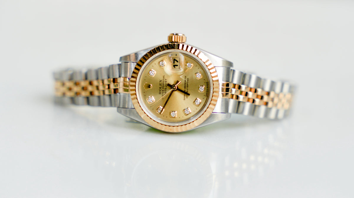 Pre-Owned Rolex Lady-Datejust 26mm â€“ 69173, Champagne Diamond Dial, 18k Yellow Gold & Stainless Steel Jubilee Bracelet