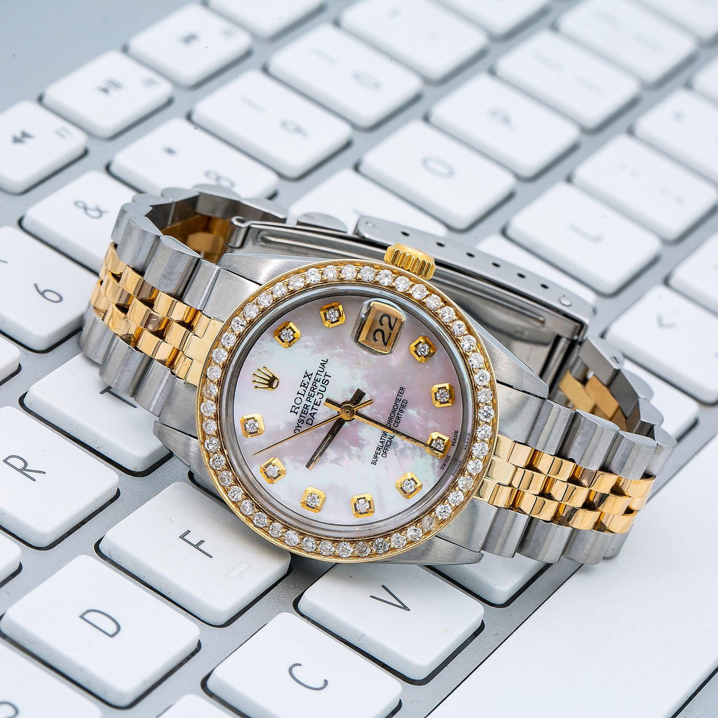 Pre-Owned Rolex Datejust 31MM 6824 Pink Mother of Pearl Diamond Dial Diamond Bezel Two Tone Yellow Gold Jubilee Bracelet