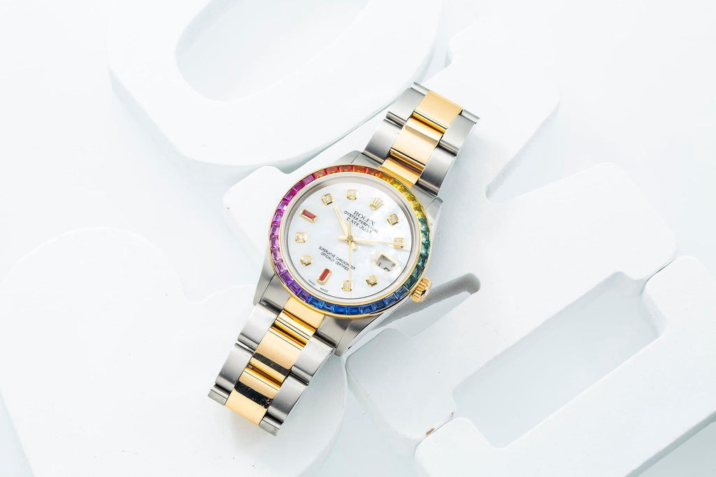 Pre-Owned Rolex Datejust 36MM 16013 Mother of Pearl Diamond Dial Rainbow Gemstone Bezel Two Tone Yellow Gold Oyster Bracelet