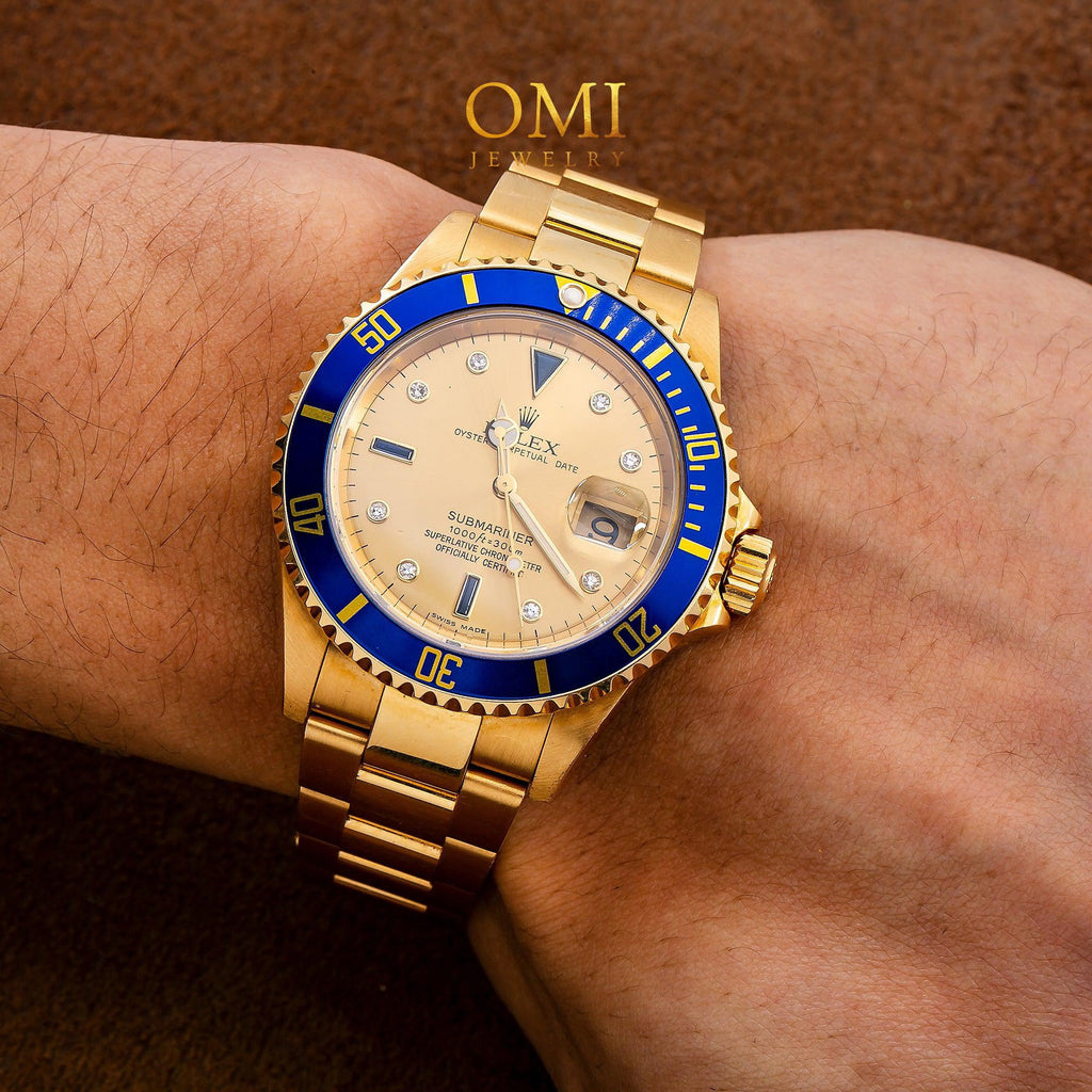 Pre-Owned Rolex Submariner Date 40MM 16618 Champagne Diamond Dial Blue Ceramic Bezel 18K Yellow Gold Oyster Bracelet