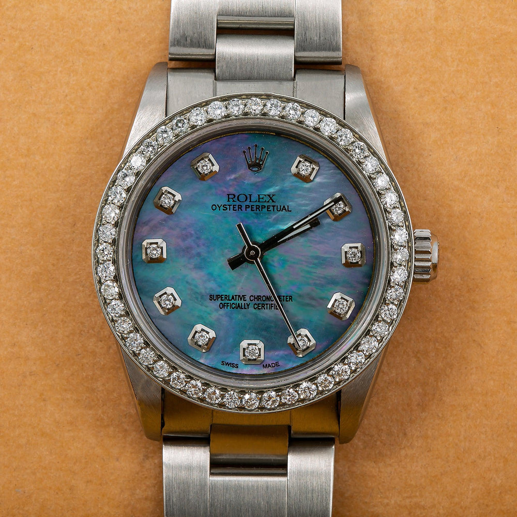 Pre-Owned Rolex Oyster Perpetual 31MM 67480 Blue Mother of Pearl Diamond Dial Diamond Bezel Stainless Steel Oyster Bracelet 1.05ct