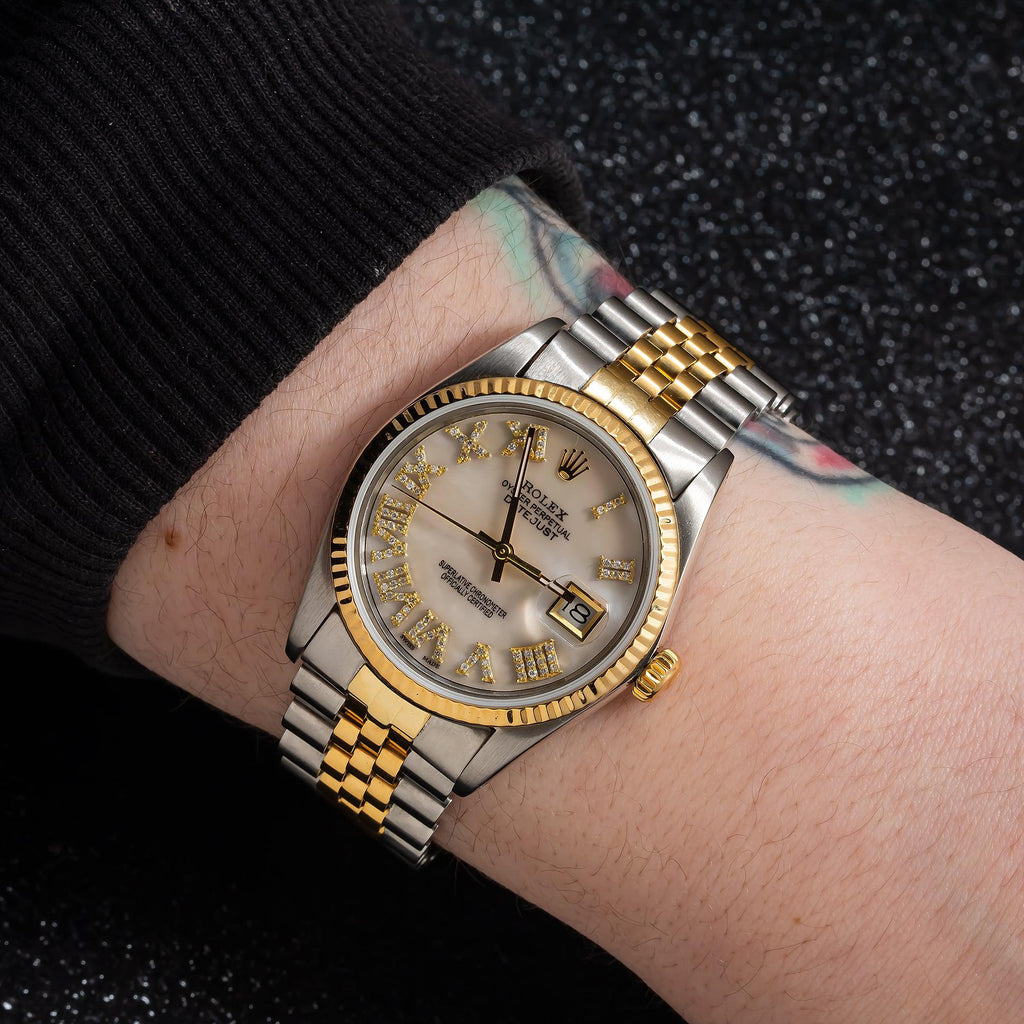 Pre-Owned Rolex Datejust 31MM 6824 Mother of Pearl Roman Diamond Dial Fluted Bezel Two Tone Yellow Gold Jubilee Bracelet